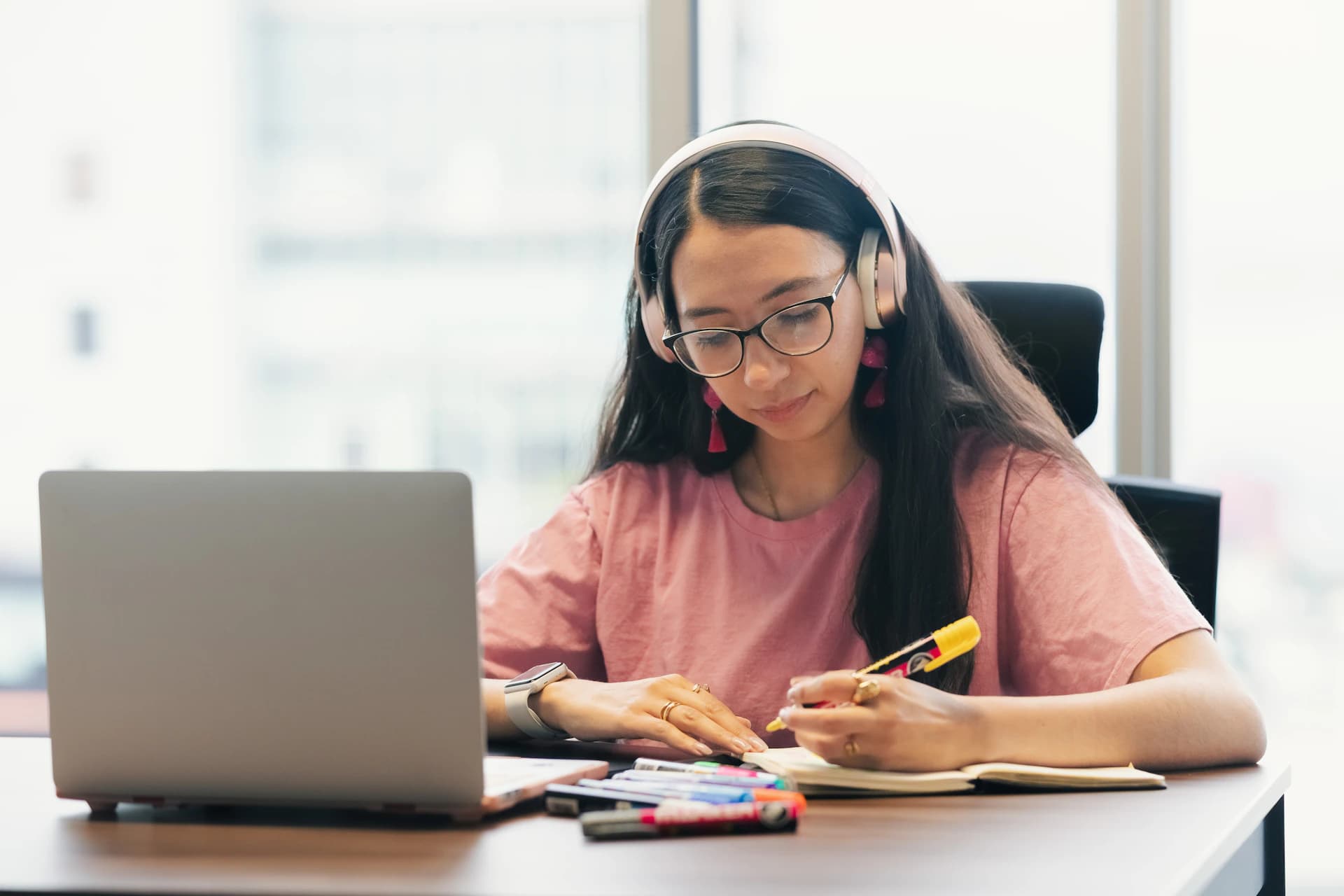 Student with headphones in an online language session