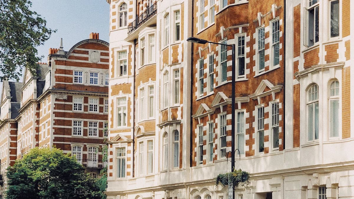 LSILHHM London campus exterior alongside an online-study workstation