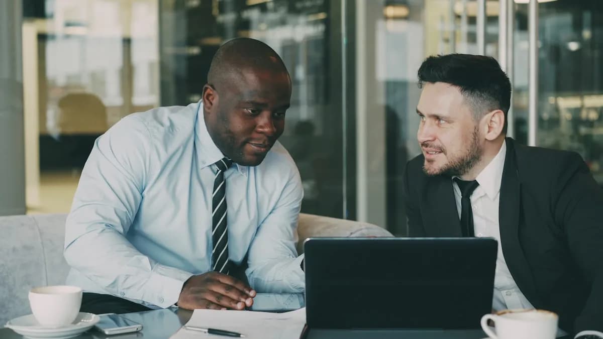 Colleagues discussing documents at a table
